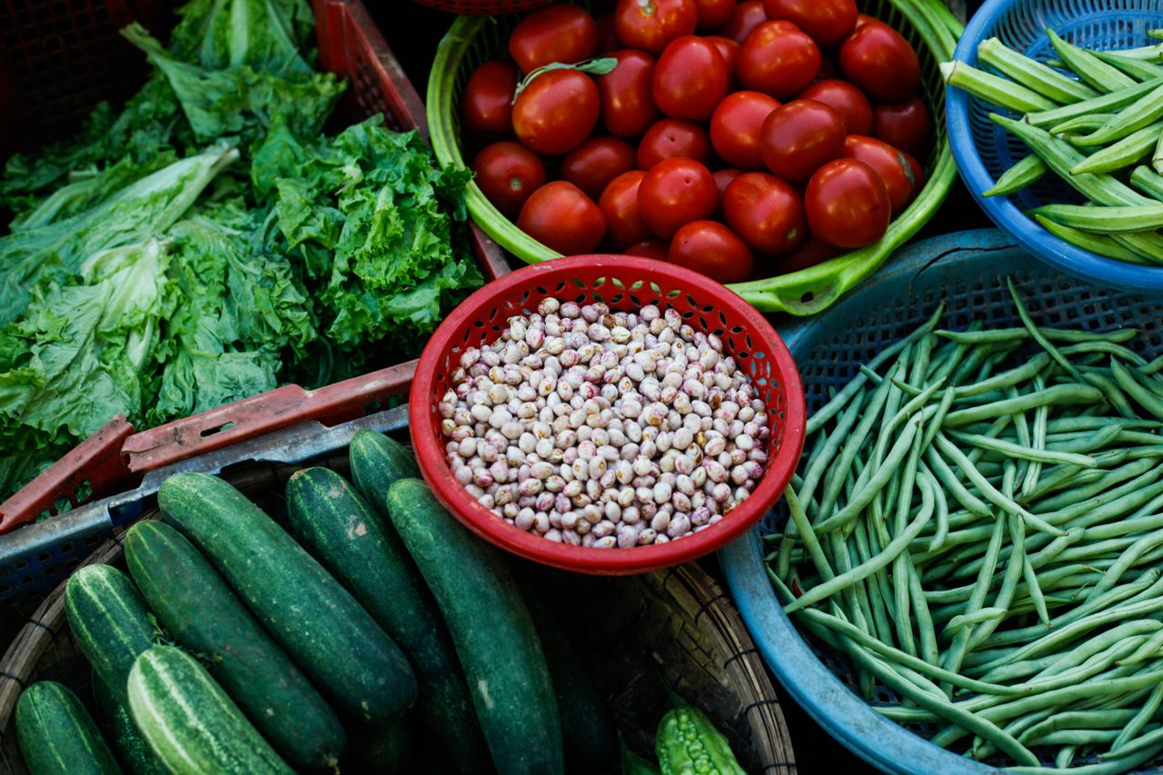 Vibrant assortment of fresh vegetables at a local Vietnamese market.